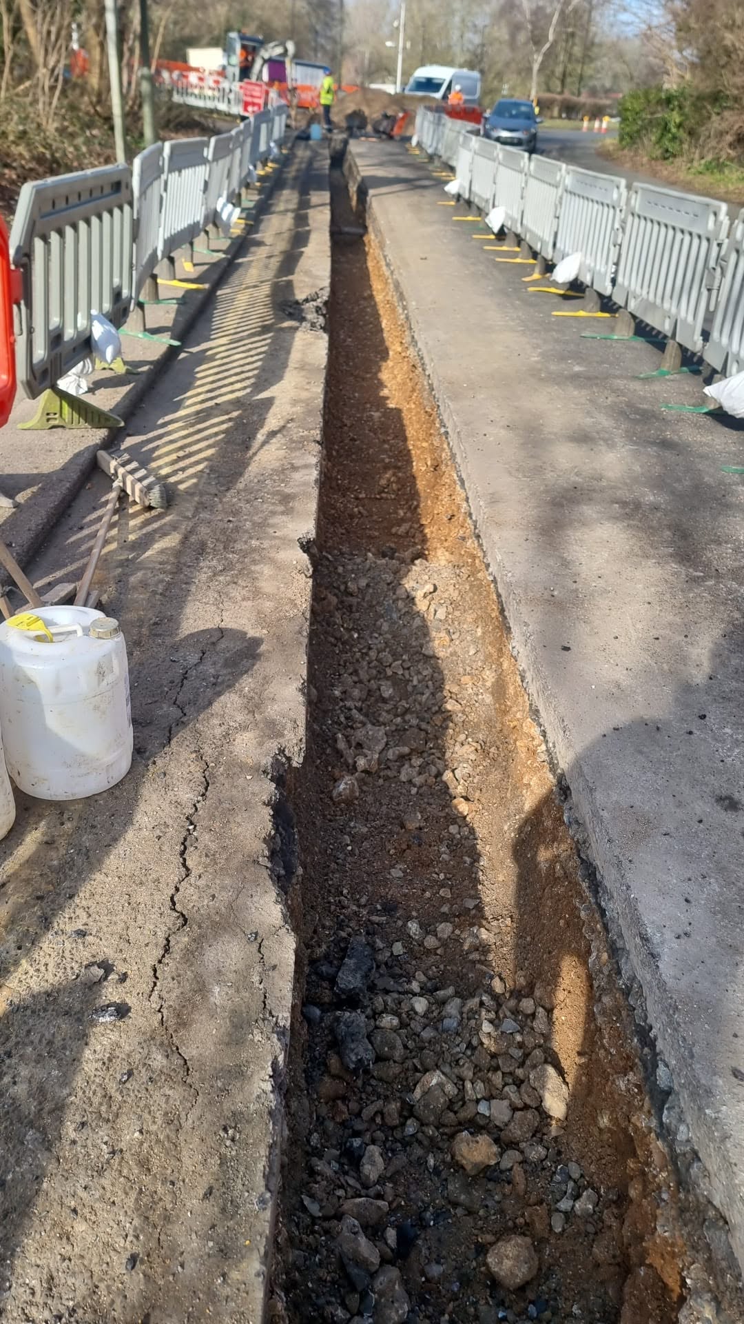 Roadside trench within a barrier-protected work area